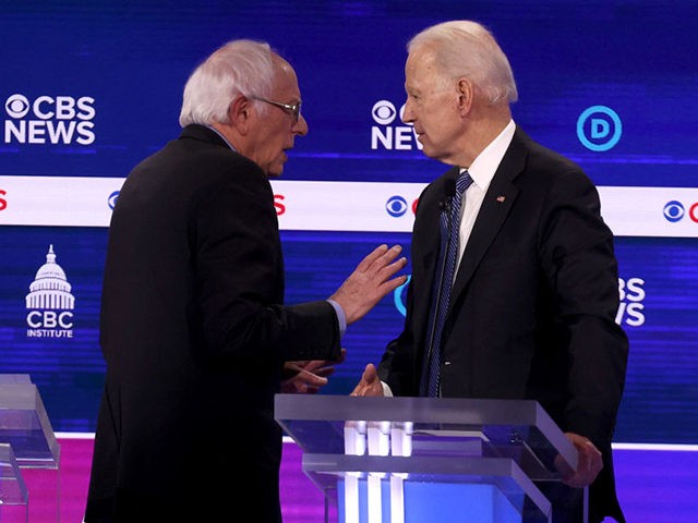 CHARLESTON, SOUTH CAROLINA - FEBRUARY 25: Democratic presidential candidates Sen. Bernie Sanders (I-VT) and former Vice President Joe Biden speak during a break at the Democratic presidential primary debate at the Charleston Gaillard Center on February 25, 2020 in Charleston, South Carolina. Seven candidates qualified for the debate, hosted by …