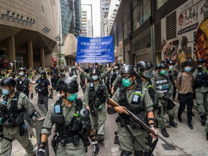 HONG KONG, CHINA - MAY 27: Riot police stand guard during a protest against a planned nati