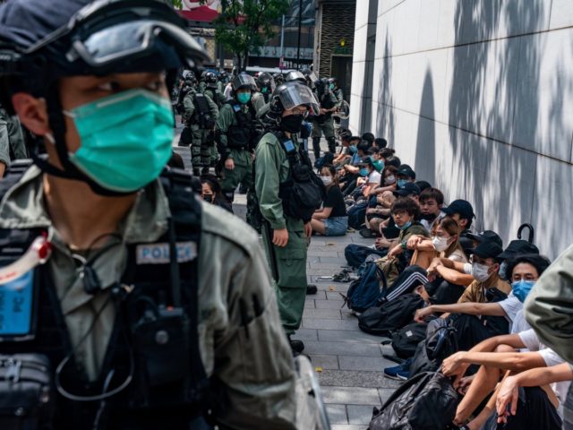 HONG KONG, CHINA - MAY 27: Riot police mass detain pro-democracy protesters during a rally in Causeway Bay district on May 27, 2020 in Hong Kong, China. Chinese Premier Li Keqiang said on Friday during the National People's Congress that Beijing would establish a sound legal system and enforcement mechanism …
