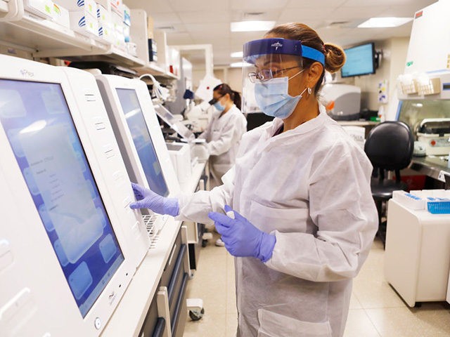 TAMPA, FL - JUNE 25: Adriana Cardenas, a medical technologist processes test samples for t