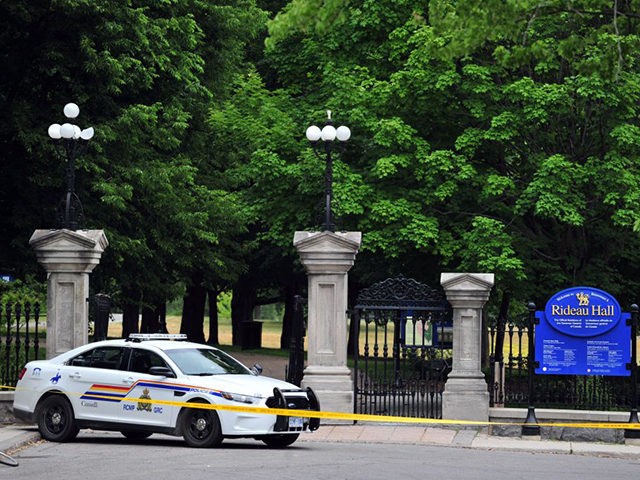 Canadian police are seen outside Rideau Hall in Ottawa, Canada on July 2, 2020, after an armed man who entered the grounds was arrested in the property that is home to Prime Minister Justin Trudeau and the country's governor general. - The suspect, who was not identified pending formal charges, …