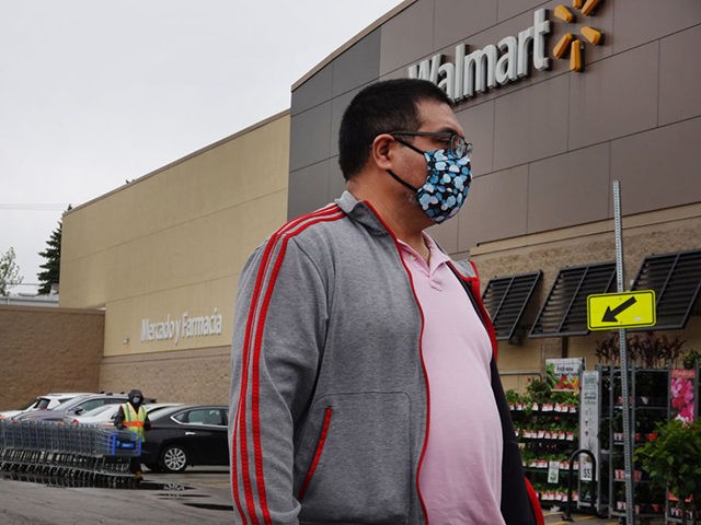 CHICAGO, ILLINOIS - MAY 19: Customers shop at a Walmart store on May 19, 2020 in Chicago, Illinois. Walmart reported a 74% increase in U.S. online sales for the quarter that ended April 30, and a 10% increase in same store sales for the same period as the effects of …