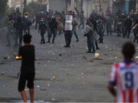 Iraqi demonstrators clash with security forces in al-Tayaran square in central Baghdad on July 27, 2020 during the ongoing anti-government protest due to poor public services. (Photo by AHMAD AL-RUBAYE / AFP) (Photo by AHMAD AL-RUBAYE/AFP via Getty Images)