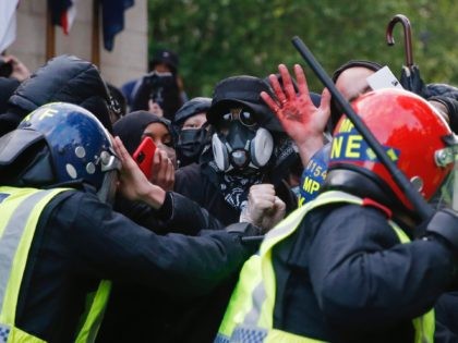 LONDON, UNITED KINGDOM - JUNE 06: Protesters clash with Police Officers during a Black Lives matter march through central London on June 6, 2020 in London, United Kingdom. The death of an African-American man, George Floyd, while in the custody of Minneapolis police has sparked protests across the United States, …