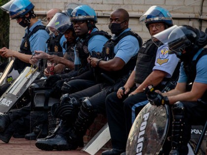 WASHINGTON, DC - JUNE 26: Police stand by as protesters for and against the removal of the Emancipation Memorial debate in Lincoln Park on June 26, 2020 in Washington, DC. The Army has activated 400 unarmed Washington D.C. National Guard troops in an effort to protect monuments amid the ongoing …