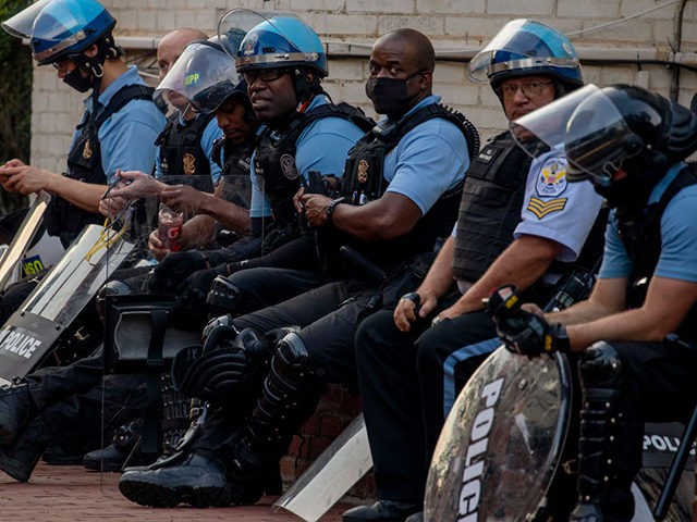 WASHINGTON, DC - JUNE 26: Police stand by as protesters for and against the removal of the