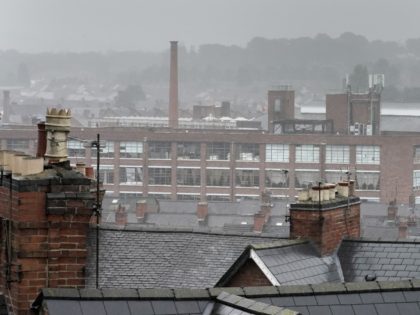 LEICESTER, ENGLAND - JULY 09: Inclement weather shrouds the roofs of homes and factories i
