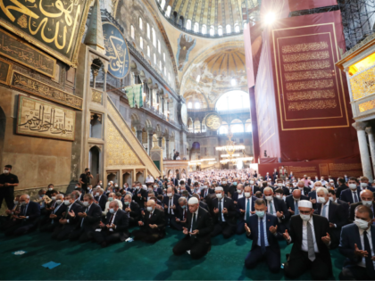 ISTANBUL, TURKEY - JULY 24: In this handout picture released by the Turkish Presidential press office, Turkey's President Recep Tayyip Erdogan (C) and invited guests attend Friday prayers at Hagia Sophia Grand Mosque during the buildings first official prayers after being reconverted into a mosque on July, 24, 2020 in …