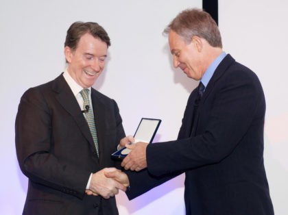 British First Secretary of State Lord Mandelson (L) presents former British Prime Minister Tony Blair with the Fenner Brockway medal for his contribution to UK-India relations during a reception at Deutsche Bank in central London, on July 3, 2009. AFP PHOTO/Leon Neal (Photo credit should read Leon Neal/AFP via Getty …