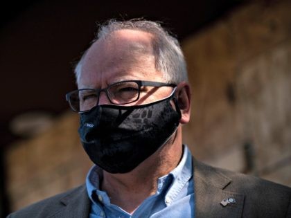 MINNEAPOLIS, MN - JUNE 05: Minnesota Governor Tim Walz tours damaged buildings on East Lake Street on June 5, 2020 in Minneapolis, Minnesota. Walz, Sen. Tina Smith (D-MN), and Sen. Amy Klobuchar (D-MN) joined business owners and community members to tour properties which were damaged during the protests and riots …