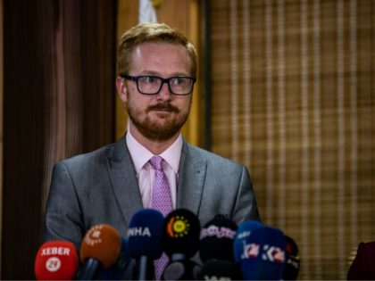 Labour MP Lloyd Russell- Moyle (L), spokesman of a delegation of British parliamentarians, addresses the media on his team's second visit to the Kurdish region in northern Syria, following a meeting with the local foreign relations authority in the Kurdish-majority city of Qamishli late on September 16, 2019 - The …
