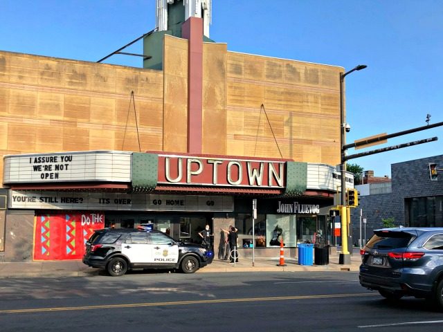 A police vehicle is parked outside the Uptown Theatre Sunday, June 21, 2020, following a s