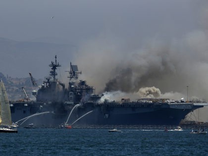 SAN DIEGO, CALIFORNIA - JULY 12: A fire burns on the amphibious assault ship USS Bonhomme Richard at Naval Base San Diego on July 12, 2020 in San Diego, California. There was an explosion on board the ship with multiple injuries reported. (Photo by Sean M. Haffey/Getty Images)