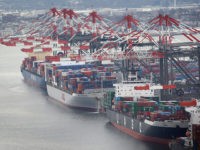 PORT NEWARK, NJ - JANUARY 31: Container ships are docked in port as seen from the window of a Customs and Border Protection (CBP), Blackhawk helicopter ahead of Super Bowl XLVIII on January 31, 2014 in Port Newark, New Jersey. Helicopters flown by "air interdiction agents" from the Customs and …