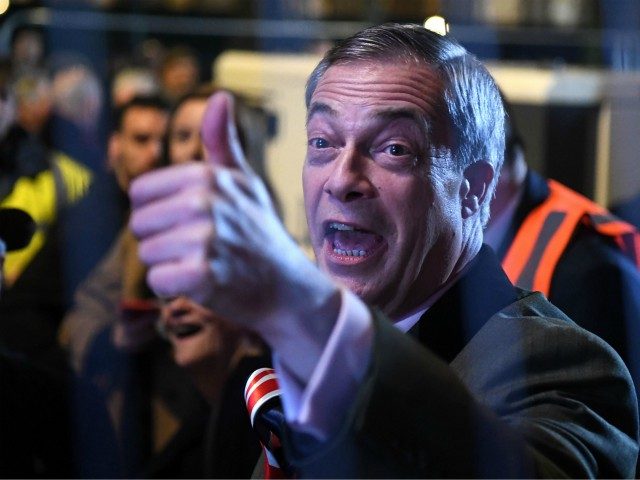 Brexit Party leader Nigel Farage gestures as he arrives in Parliament Square, venue for th