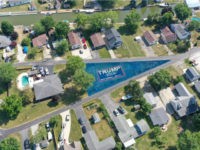 J.R. Majewski of Port Clinton, Ohio, painted his large, oddly shaped yard in support of President Donald Trump’s reelection.