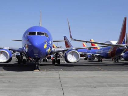Southwest Airlines airplanes sit parked Tuesday, April 7, 2020, at Paine Field airport in Everett, Wash. A steep decline in travel due to the outbreak of the coronavirus has pushed airlines to cancel flights, run fewer planes and seek government aid. (AP Photo/Ted S. Warren)