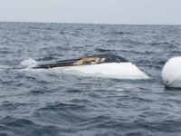 Coast Guardsmen and a CBP AMO aircrew team up to rescue 14 migrants and seize 82 pounds of methamphetamine. (Photo: U.S. Customs and Border Protection)