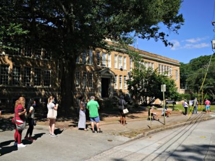 ATLANTA, GA - JULY 11: People stand in line to get tested for COVID-19 at a free walk-up t