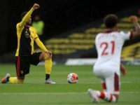 Watford's French midfielder Etienne Capoue (L) gestures in support of the Black Lives Matter movement during the English Premier League football match between Watford and Southampton at Vicarage Road Stadium in Watford, north of London on June 28, 2020. (Photo by ADAM DAVY/POOL/AFP via Getty Images)