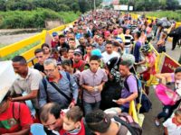 Venezuelan citizens cross the Simon Bolivar International Bridge from San Antonio del Tachira in Venezuela to the Norte de Santander province of Colombia.GEORGE CASTELLANOS/AFP/Getty Images
