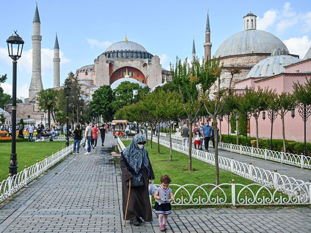 People walk in front of Hagia Sophia on July 11, 2020 in Istanbul, a day after a top Turki