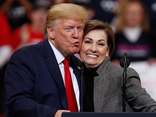 DES MOINES, IA - JANUARY 30: U.S. President Donald Trump gives a kiss on the cheek to Iowa Governor Kim Reynolds during a campaign rally inside of the Knapp Center arena at Drake University on January 30, 2020 in Des Moines, Iowa. President Trump is campaigning in Iowa a few days before nation’s first presidential caucuses. (Photo by Tom Brenner/Getty Images)