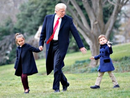 President Donald Trump walks with his grandchildren. Arabella Kushner and Joseph Kushner, holding a model of Marine One, across the South Lawn of the White House in Washington, Friday, March 3, 2017, before boarding Marine One helicopter for the short flight to nearby Andrews Air Force Base, Friday, March 3, …
