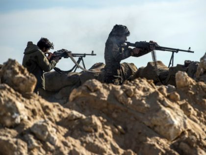 Fighters with the US-backed Syrian Democratic Forces (SDF) keep a position during an opera