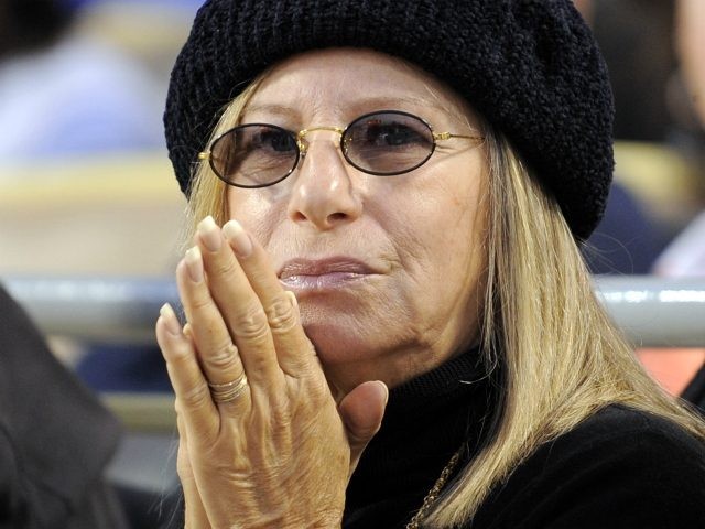 Entertainer Barbara Streisand watches the Los Angeles Dodgers play the Philadelphia Phillies during Game 4 of the National League baseball championship series Monday, Oct. 13, 2008, in Los Angeles. (AP Photo/Mark J. Terrill)