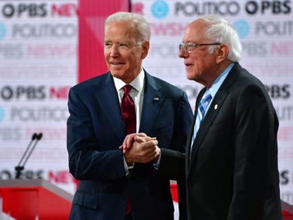 Democratic presidential hopefuls former Vice President Joe Biden (L) and Vermont Senator B