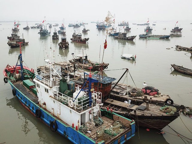 Fishing boats head back to a port as fisherfolks prepare for the summer fishing moratorium