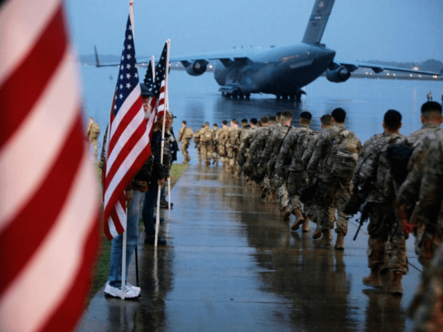 Paratroopers board an aircraft at Fort Bragg on January 4, 2020. The fort is one of many n