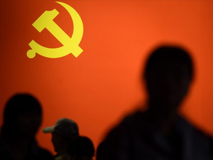 TOPSHOT - This picture taken on October 10, 2017 shows a party flag of the Chinese Communist Party displayed at an exhibition showcasing China's progress in the past five years at the Beijing Exhibition Center. China's police and censorship organs have kicked into high gear to ensure that the party's …
