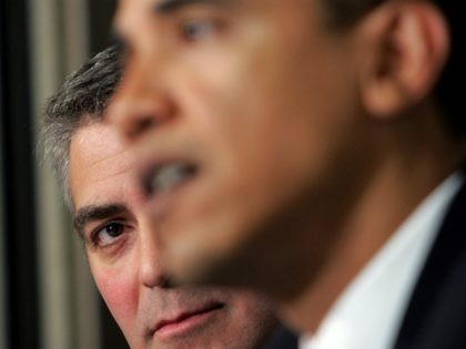 WASHINGTON - APRIL 27: Actor George Clooney (L) listens as Sen. Barack Obama (R) speaks at The National Press Club Newsmaker's Program April 27, 2006 in Washington, DC. Clooney joined Sen. Sam Brownback and Sen. Obama in discussing the current situation in the Darfur region of Sudan and also held …
