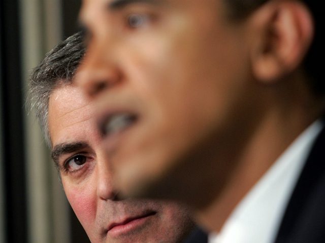 WASHINGTON - APRIL 27: Actor George Clooney (L) listens as Sen. Barack Obama (R) speaks at
