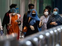Pregnant Indian citizens evacuated from Dubai by an Air India flight arrive at the Anna International Airport in Chennai on May 9, 2020. - The first wave of a massive exercise to repatriate hundreds of thousands of Indians stuck abroad began May 7, with two flights landing in India from …
