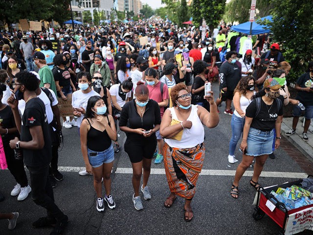 WASHINGTON, DC - JUNE 19: People fill 16th Street north of the White House, now called Bla