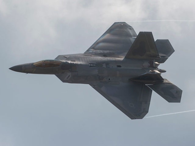 An F-22 Raptor does a fly-by during the airshow at Joint Andrews Air Base in Maryland on S