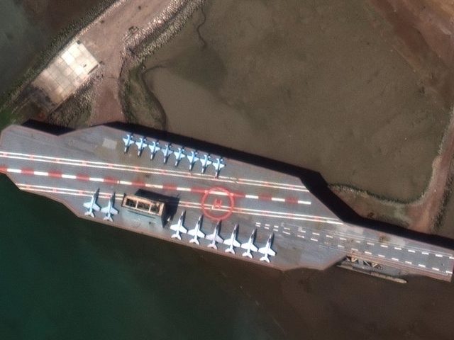 In this Feb. 15, 2020, satellite photo provided on July 27, 2020, by Maxar Technologies, a mockup aircraft carrier built by Iran is seen at Bandar Abbas, Iran, before being put to sea. Satellite photographs released Monday, July 27, showed Iran has moved the aircraft carrier out to sea likely …