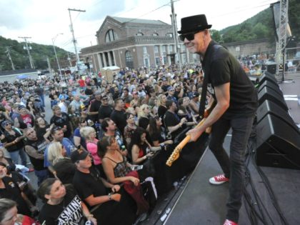 FILE - In this June 23, 2018, file photo, Mark Kendall, center, with the band Great White,