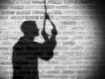 Shadow of sad man hanging suicide. light and shadow