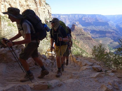 FILE - In this July 27, 2015, file photo, a long line of hikers head out of the Grand Canyon along the Bright Angel Trail at Grand Canyon National Park, Ariz. Authorities have seen a big increase in search and rescue missions in northern Arizona, driven by a surge in …