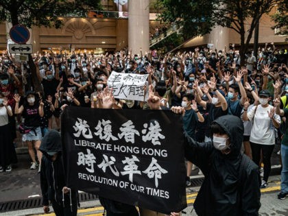 HONG KONG, CHINA - JULY 01: Demonstrators take part in a protest against the new national