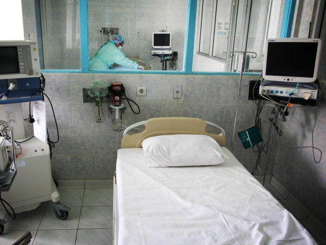 A nurse prepares isolation rooms for any suspected cases of bird or swine flu at the Sarjito hospital on May 1, 2009 in Yogyakarta, Indonesia. The World Health Organisation has issued a phase five Swine Influenza Virus (SIV) pandemic warning following the outbreak with positive reports of the virus spreading …