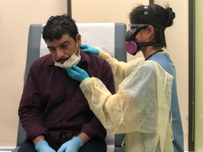 Guatemalan immigrant Marvin is checked by a physician's assistant before receiving a COVID-19 swab test at a clinic on May 5, 2020 in Stamford, Connecticut. Marvin and his son Junior were re-tested to see if they are now are negative, a month after getting sick from coronavirus. Marvin's wife Zully, …