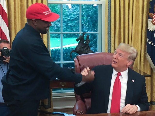 (Files) in this file photo US President Donald Trump meets with rapper Kanye West in the Oval Office of the White House in Washington, DC, October 11, 2018. - Kanye West, the entertainment mogul who urges listeners in one song to "reach for the stars, so if you fall, you …