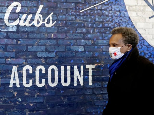 Chicago Mayor Lori Lightfoot tours Wrigley Field's concourse in Chicago, Thursday, April 16, 2020. The Chicago Cubs are coordinating with Lakeview Pantry to utilize the concourse as a satellite food packing and distribution center to support COVID-19 relief efforts. (AP Photo/Nam Y. Huh)