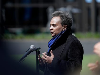 Chicago Mayor Lori Lightfoot speaks at a news conference in front of Wrigley Field in Chicago, Thursday, April 16, 2020. The Chicago Cubs are coordinating with Lakeview Pantry to utilize the field's concourse as a satellite food packing and distribution center to support COVID-19 relief efforts. (AP Photo/Nam Y. Huh)