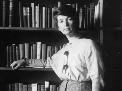 1916: Full-length portrait of American nurse and social reformer Margaret Sanger leaning against a bookcase. (Photo by Hulton Archive/Getty Images)